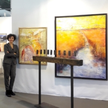 Virginia at the booth in Art3F Brussels with two of her works