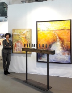 Virginia at the booth in Art3F Brussels with two of her works
